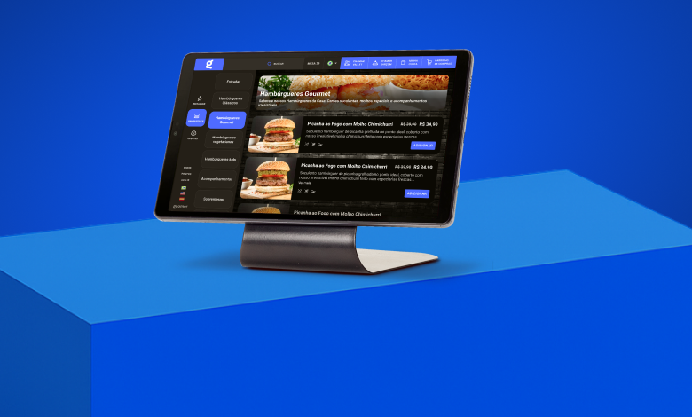 Tela de computador exibindo um site de pedidos de hambúrgueres gourmet, em um ambiente moderno com fundo azul vibrante, ideal para quem busca opções de comida online.